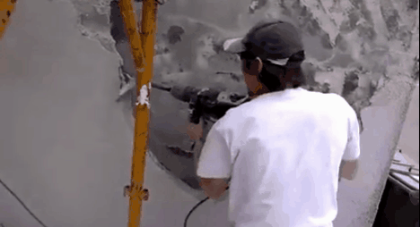 Guy incorrectly using a rotary hammer